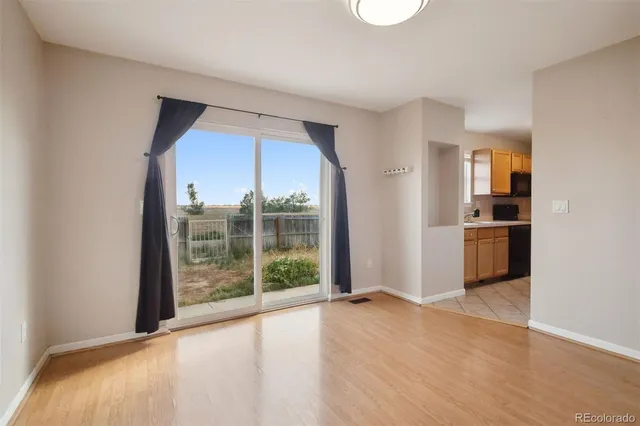 a view of a kitchen with a sink and a large window