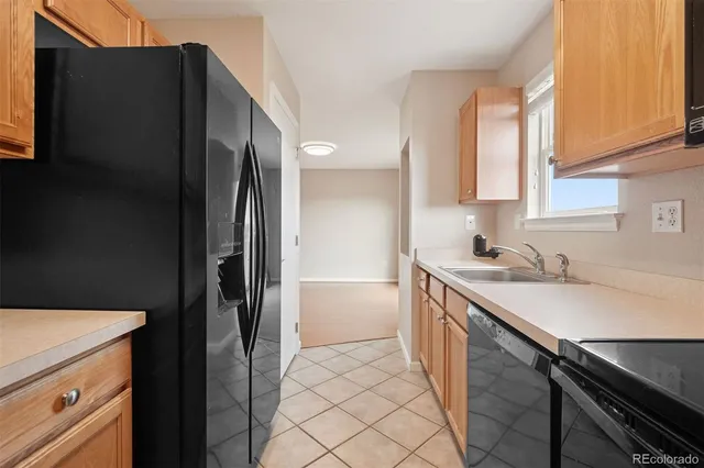 a kitchen with a sink stove and refrigerator