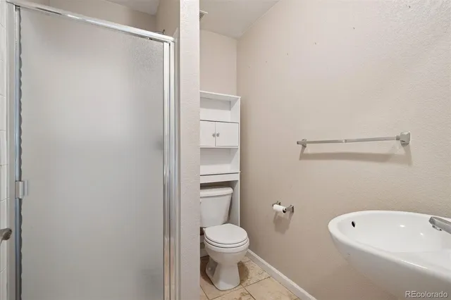 a bathroom with a toilet and a sink