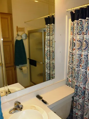 a bathroom with a bathtub and shower