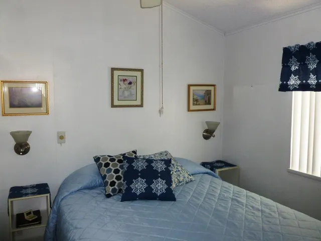 a bed room with furniture and a window