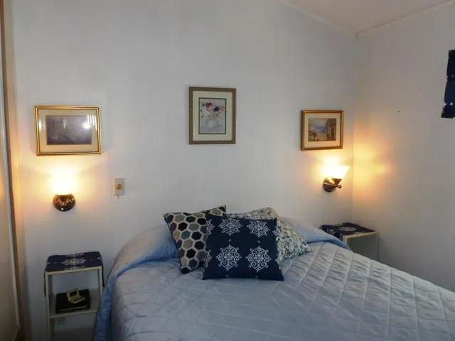 a bed room with furniture and a window