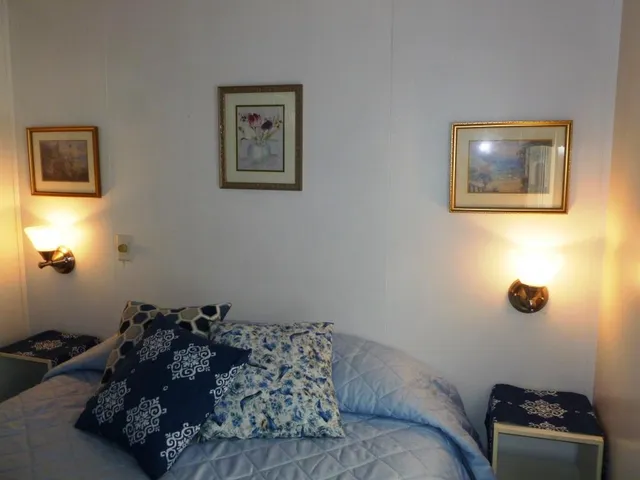 a bed room with a bed and a couch