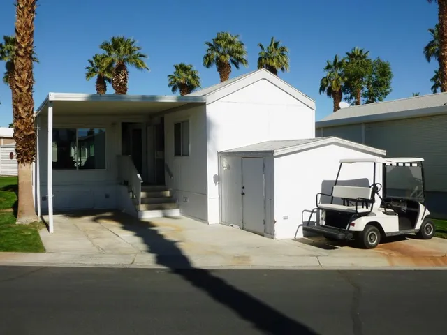 a view of a car park in front of house