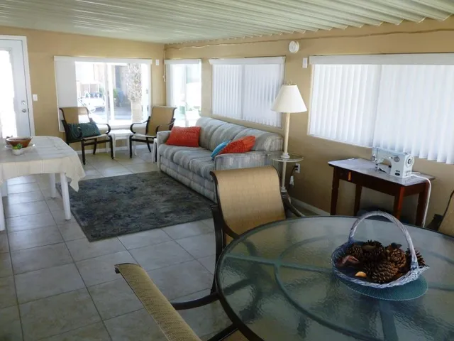 a living room with furniture and a table