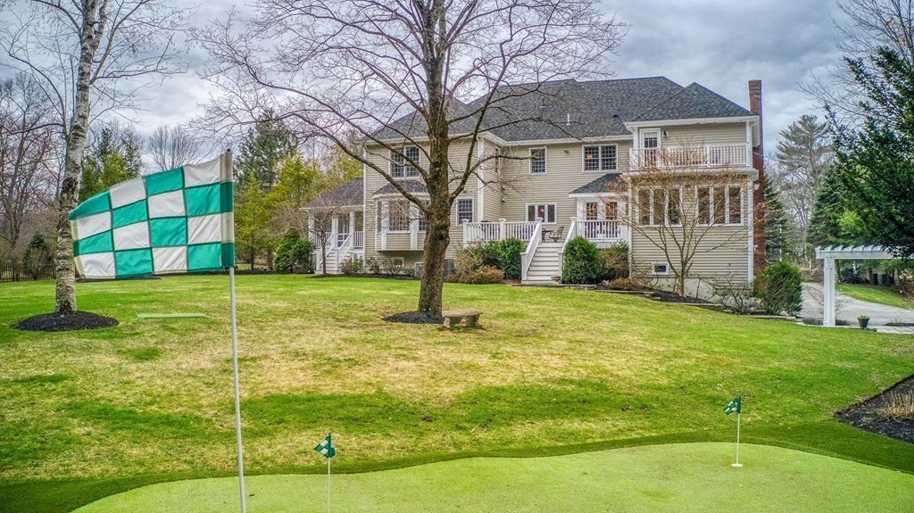 4 Paddock Lane Andover, MA 01810 - Photo 1 of 42 a view of a brick house with a yard