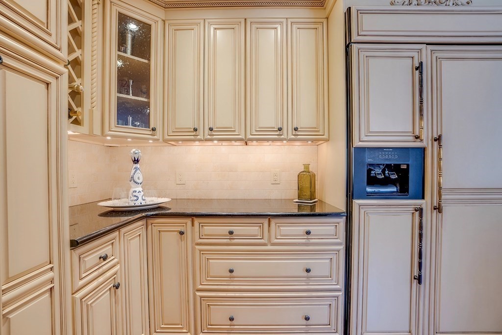 4 Paddock Lane Andover, MA 01810 - Photo 14 of 42 a kitchen with granite countertop a sink and cabinets