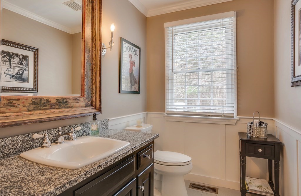 4 Paddock Lane Andover, MA 01810 - Photo 20 of 42 a bathroom with a granite countertop sink and a mirror