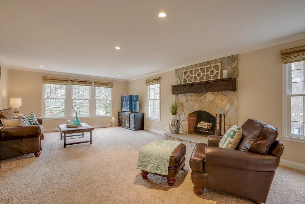 4 Paddock Lane Andover, MA 01810 - Photo 21 of 42 a living room with furniture and a fireplace