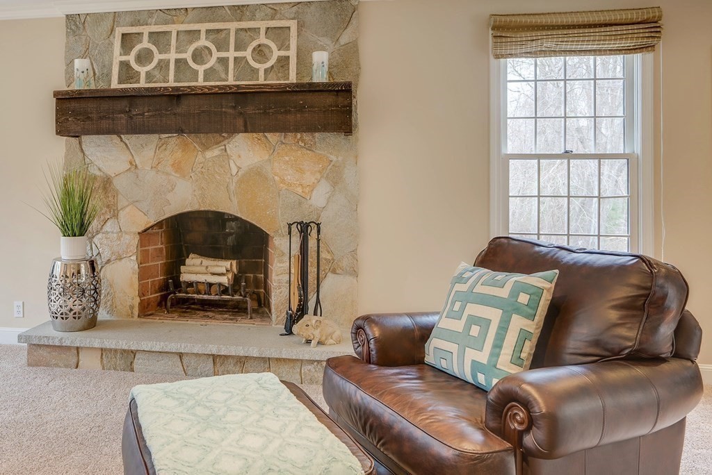 4 Paddock Lane Andover, MA 01810 - Photo 22 of 42 a living room with furniture and a fireplace