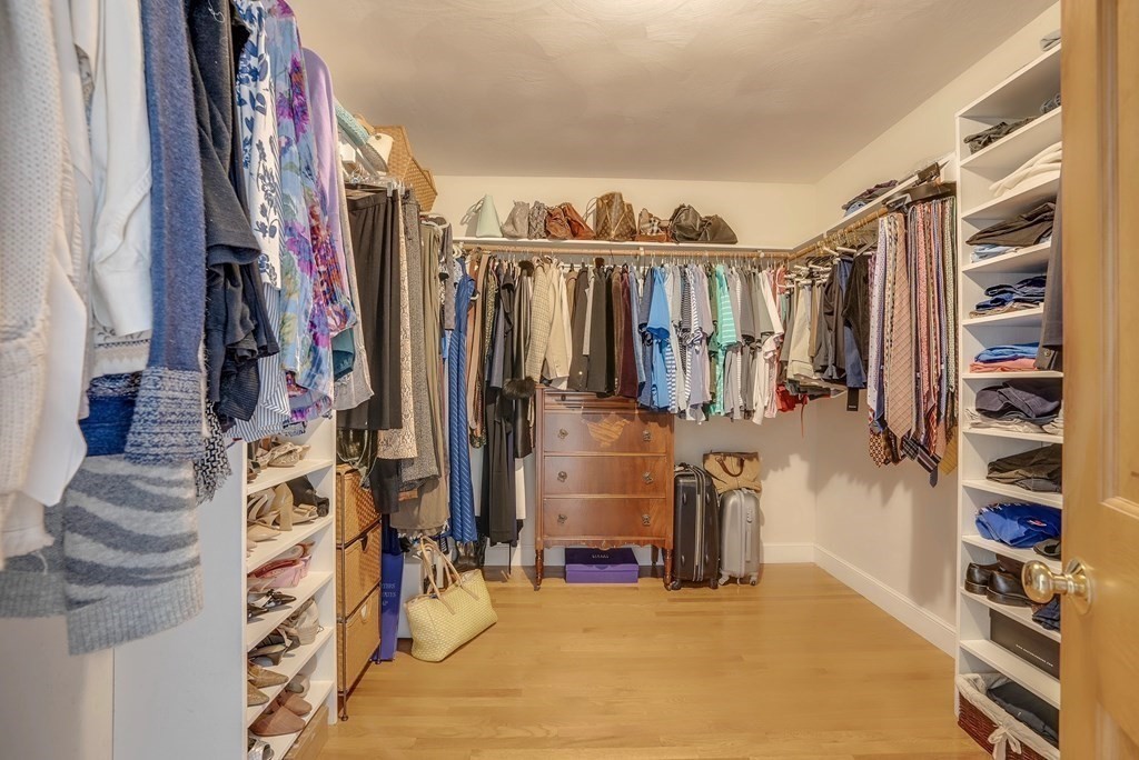4 Paddock Lane Andover, MA 01810 - Photo 30 of 42 a view of walk in closet with clothes and shoes