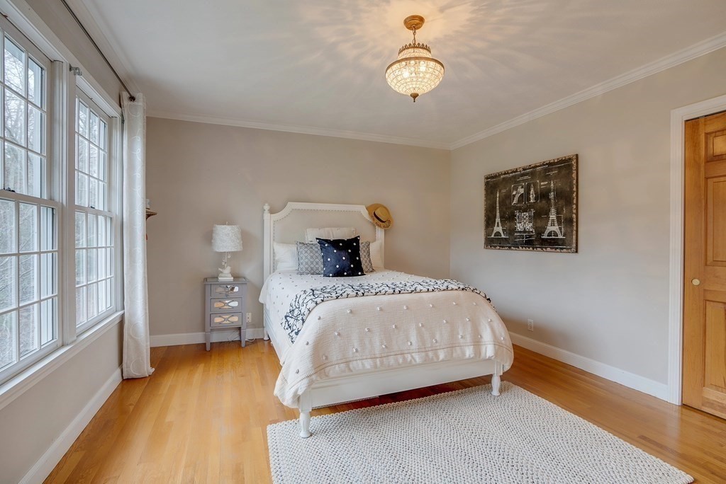 4 Paddock Lane Andover, MA 01810 - Photo 34 of 42 a bedroom with a bed and wooden floor