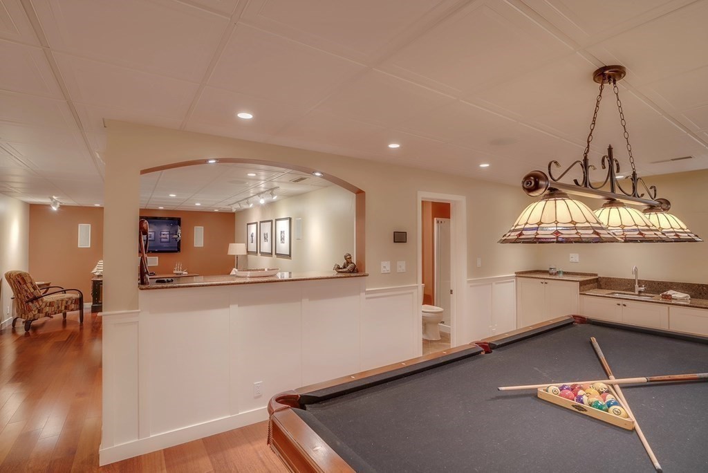 4 Paddock Lane Andover, MA 01810 - Photo 38 of 42 a kitchen with a sink cabinets and wooden floor