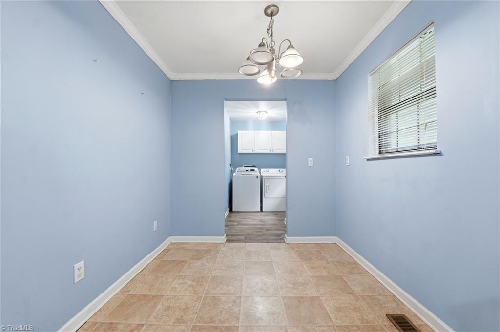 3546 Lewiston Road Greensboro, NC 27410 - Photo 11 of 32 Dining area with access to laundry room