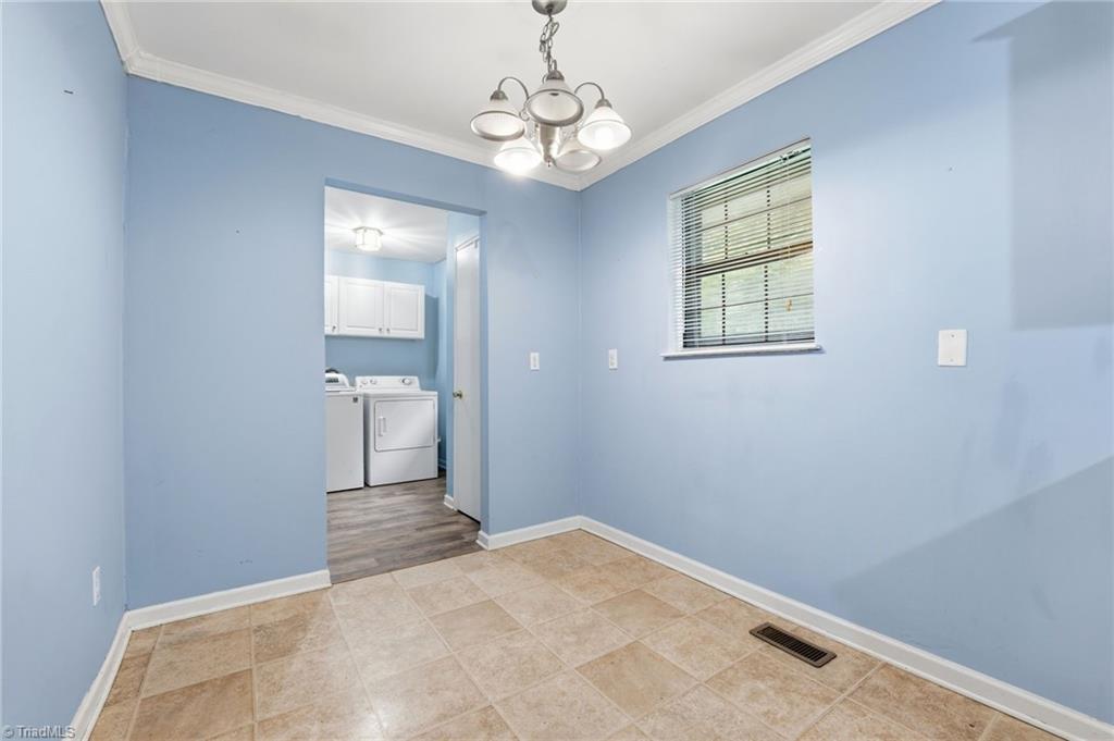 3546 Lewiston Road Greensboro, NC 27410 - Photo 12 of 32 Dining area with access to laundry room