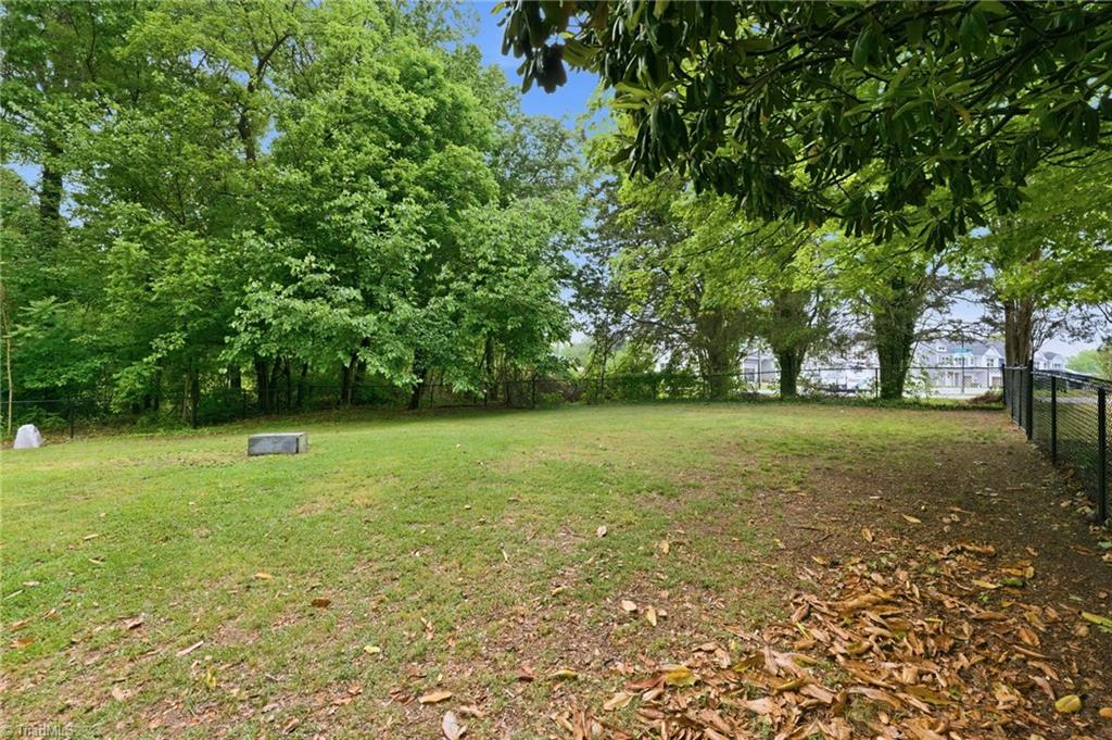 3546 Lewiston Road Greensboro, NC 27410 - Photo 2 of 32 Spacious backyard, fenced with storage building