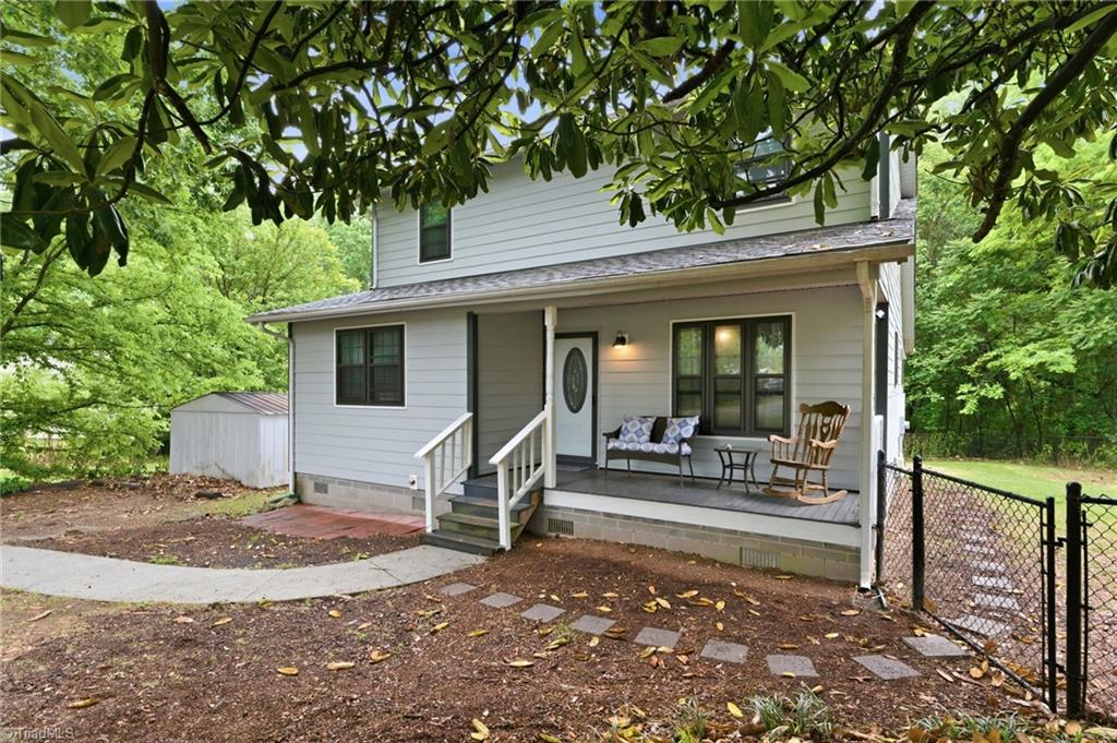3546 Lewiston Road Greensboro, NC 27410 - Photo 25 of 32 View of the front of the home with covered front porch