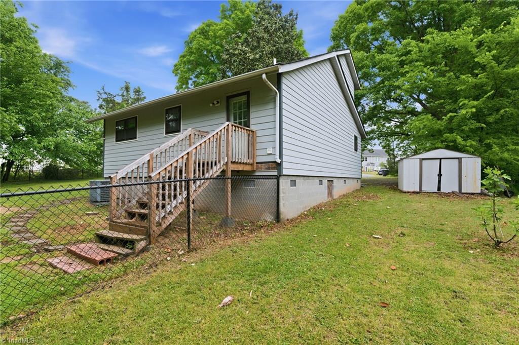 3546 Lewiston Road Greensboro, NC 27410 - Photo 30 of 32 Back of the home with fenced area perfect for pets
