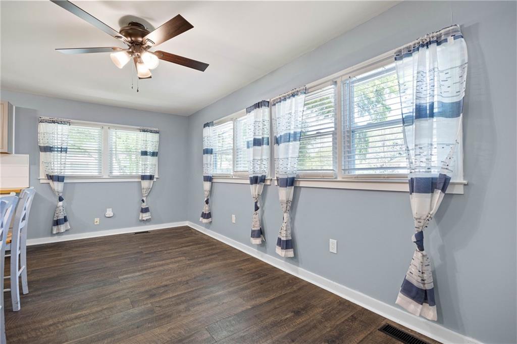 3871 Furr Avenue Powder Springs, GA 30127 - Photo 12 of 32 a view of a room with wooden floor and white walls