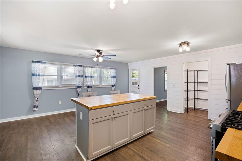 3871 Furr Avenue Powder Springs, GA 30127 - Photo 14 of 32 a kitchen with a sink cabinets and wooden floor