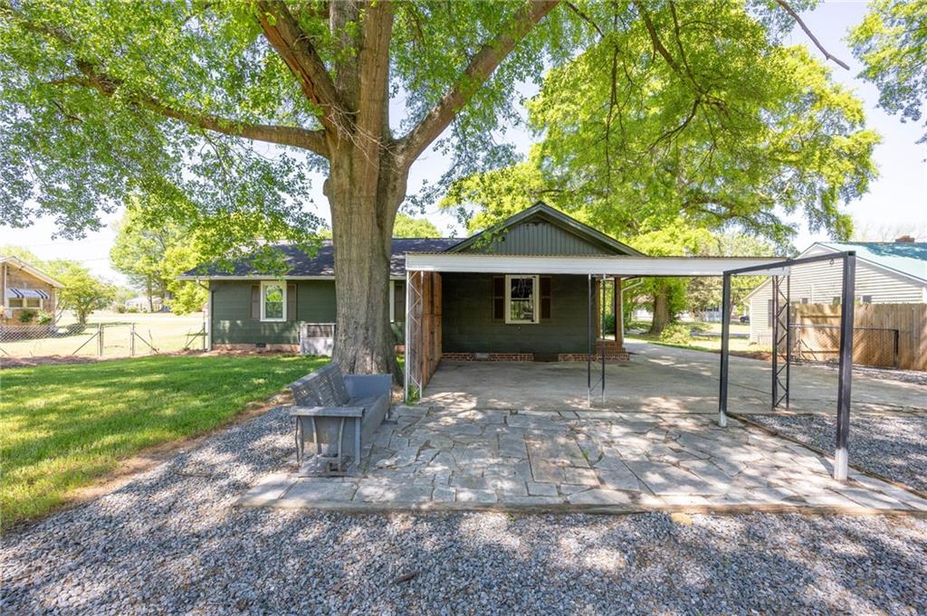3871 Furr Avenue Powder Springs, GA 30127 - Photo 25 of 32 a view of a house with backyard and a tree