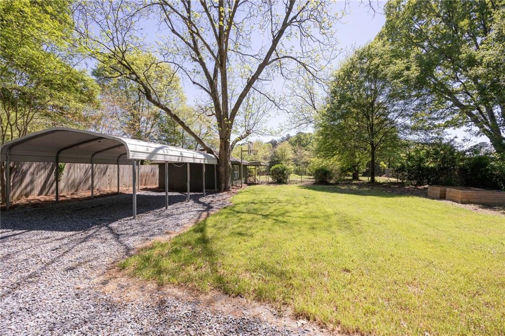 3871 Furr Avenue Powder Springs, GA 30127 - Photo 26 of 32 a view of a house with a yard