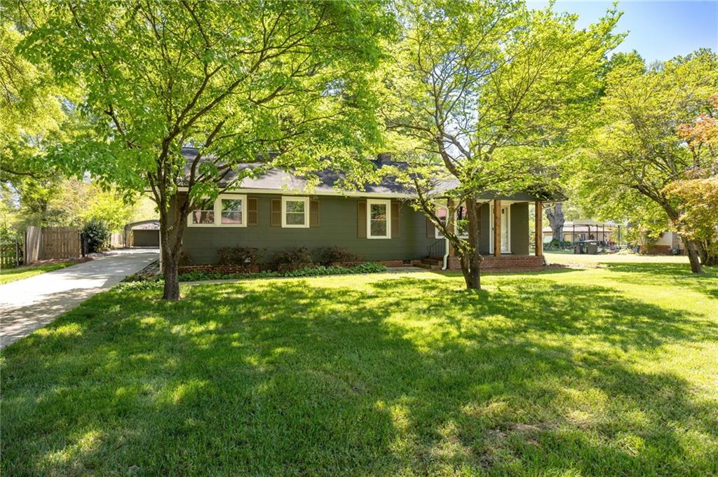 3871 Furr Avenue Powder Springs, GA 30127 - Photo 3 of 32 a view of a house with yard and tree s