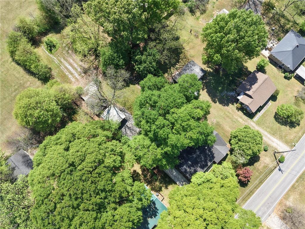 3871 Furr Avenue Powder Springs, GA 30127 - Photo 32 of 32 an aerial view of residential house with outdoor space and trees all around