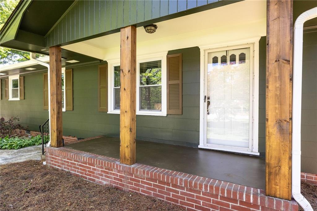 3871 Furr Avenue Powder Springs, GA 30127 - Photo 5 of 32 a front view of a house with a glass door