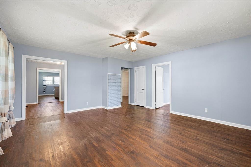 3871 Furr Avenue Powder Springs, GA 30127 - Photo 8 of 32 a view of empty room with wooden floor and fan