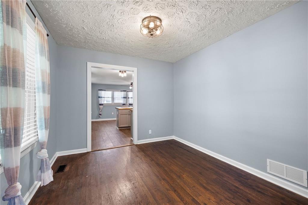 3871 Furr Avenue Powder Springs, GA 30127 - Photo 10 of 32 a view of a room with wooden floor and a window