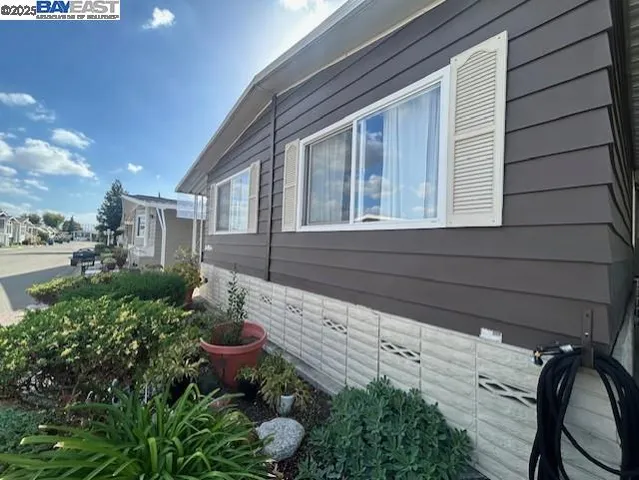 a view of a backyard with sitting area
