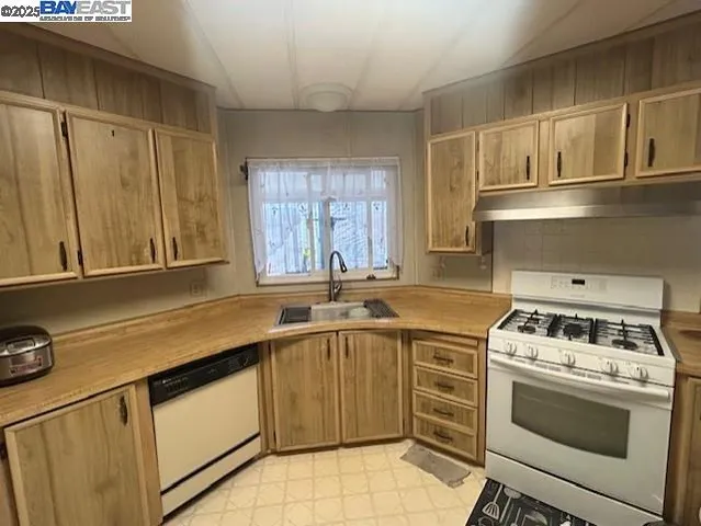 a kitchen with a stove and a refrigerator