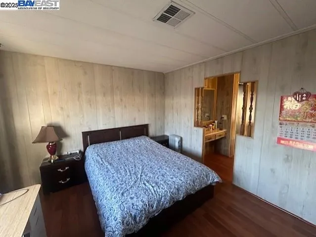 a spacious bathroom with a granite countertop sink mirror and bathtub