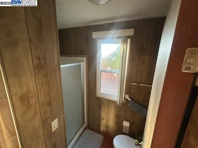 a bedroom with a bed and a closet