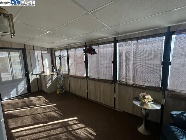 a sign that is sitting on a wooden wall