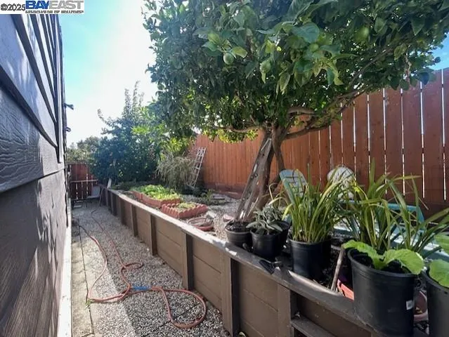 a view of a livingroom with furniture wooden floor and a fireplace