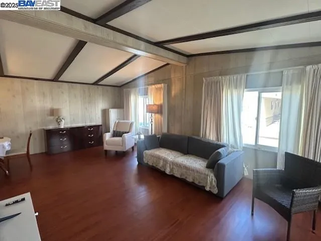 a living room with couches and a large window