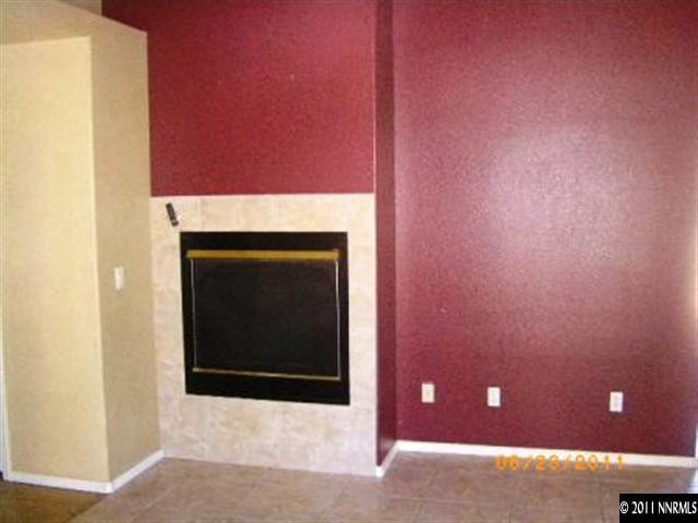 2489 Cartwright Road Reno, NV 89521 - Photo 5 of 10 a view of an empty room with a fireplace