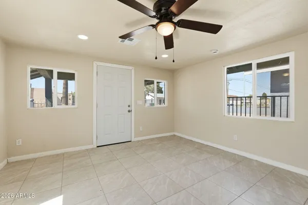 a view of an empty room with a window