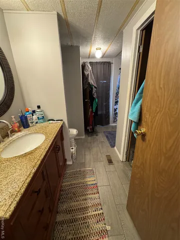 a bathroom with a sink and mirror