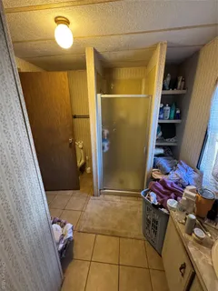 a bathroom with a sink and a shower