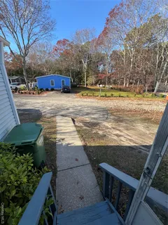 a view of a yard with an outdoor seating