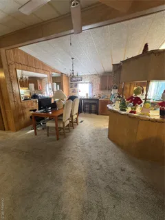 a living room with lots of furniture and gym equipment