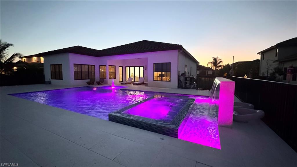 5340 Allen Place Ave Maria, FL 34142 - Photo 20 of 35 View of pool featuring a pool with connected hot tub and a patio area
