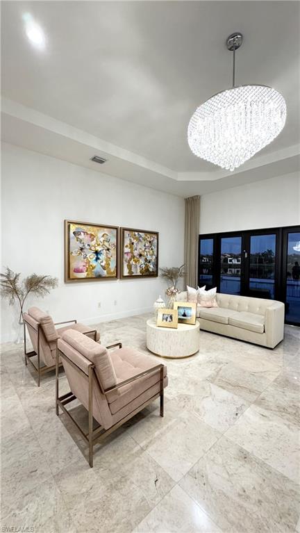 5340 Allen Place Ave Maria, FL 34142 - Photo 9 of 35 Living area with a chandelier