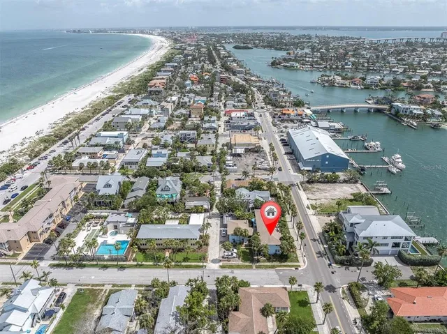 an aerial view of residential building and lake