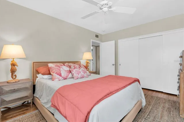 a bedroom with a bed and a lamp