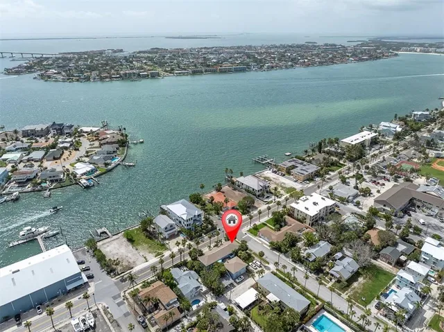 an aerial view of a houses with ocean view
