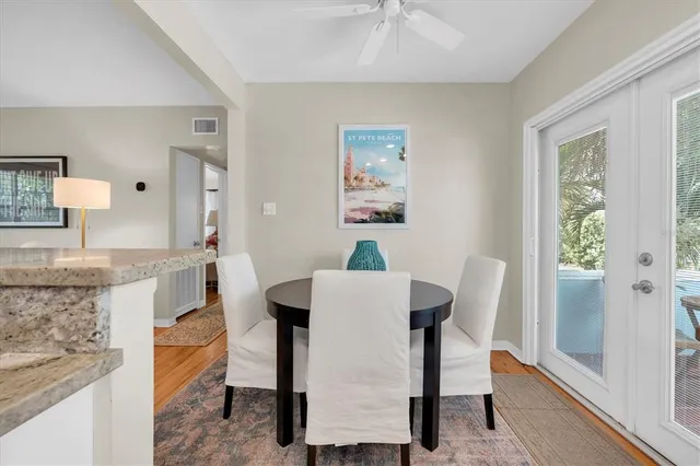 a dining room with furniture and a window